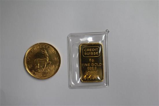 A gold 1/4 Krugerrand, a credit suisse 5g gold bar.